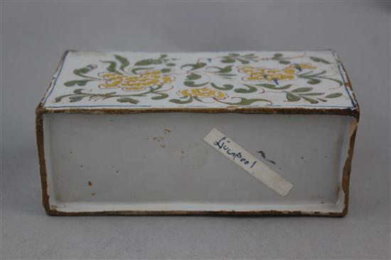 An English delftware polychrome flower brick, c.1760, possibly Liverpool, 17.5cm.
